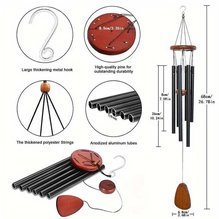 Classic black aluminum wind chimes with wooden tag hanging outdoors in a garden setting